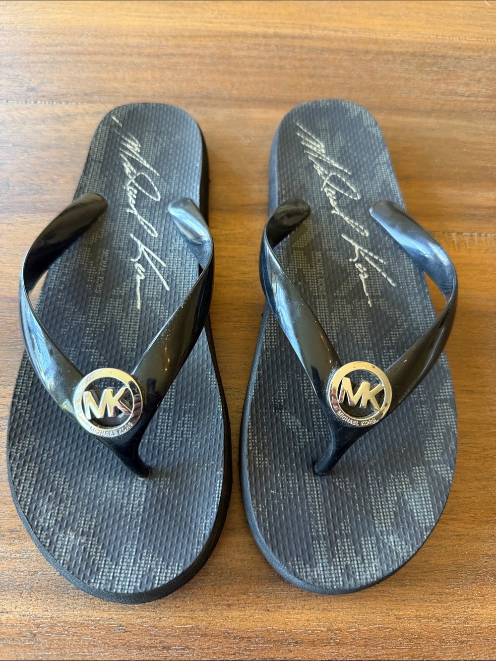 Michael Kors Black and Gold MK Logo Jelly Flip Flop Sandals